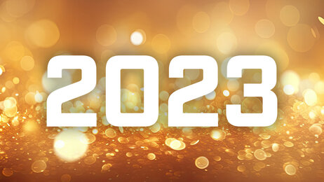 Bildet viser gult glitter og årstallet 2023